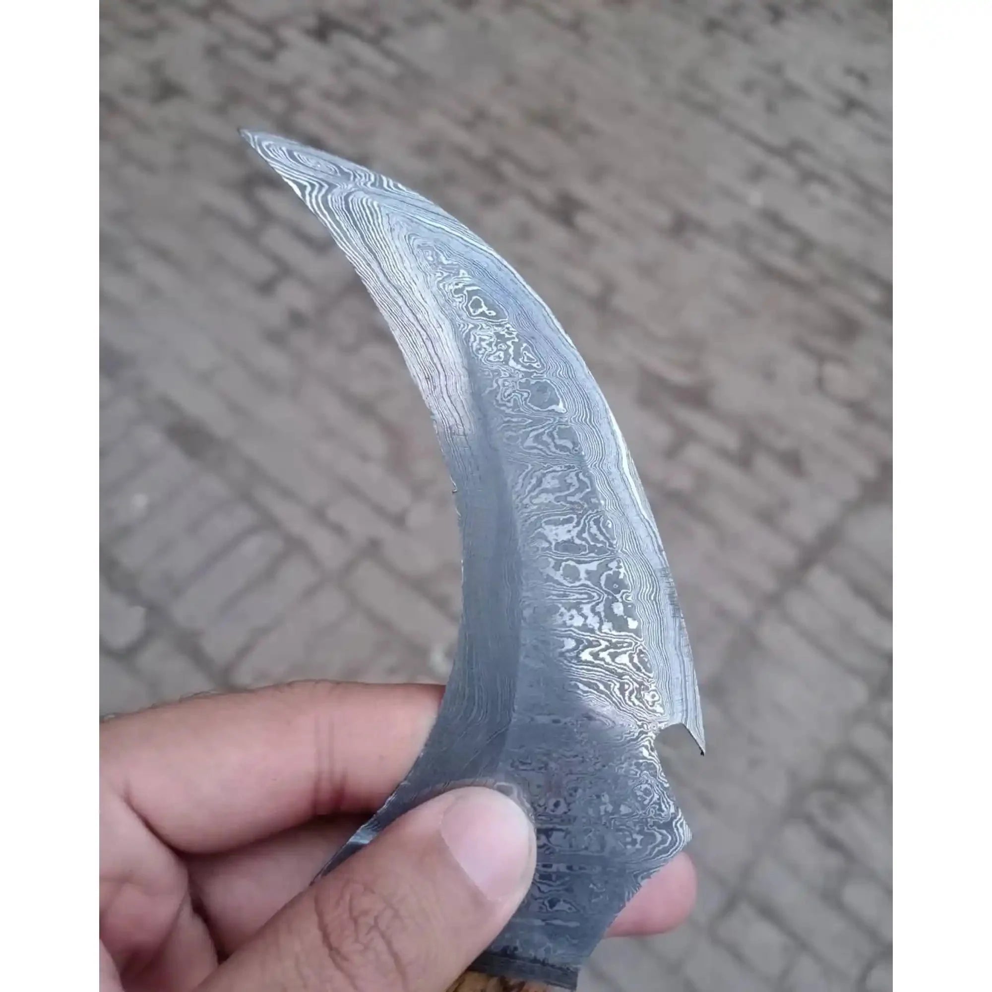 Damascus karambit knife..